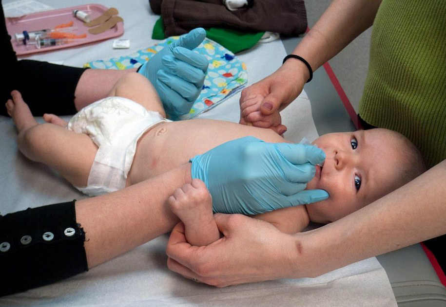 A baby receives a vaccination