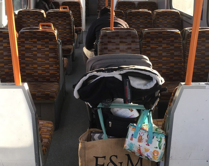 A loaded up pushchair on a train